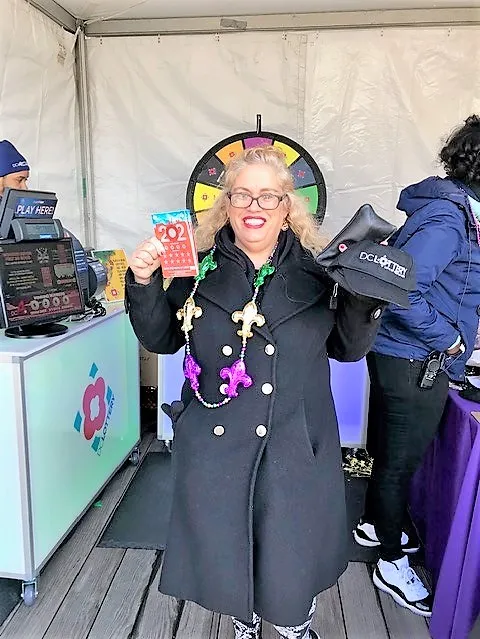 Player holding scratch ticket