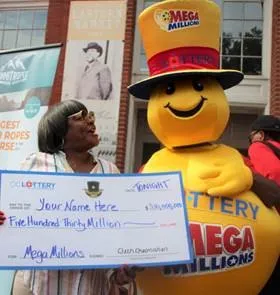 Woman holding large check next to Mega Millions mascot
