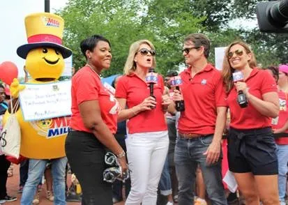 Fox 5 news crew with Mega Millions mascot