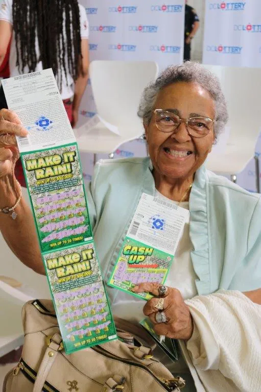 woman holding scratch tickets