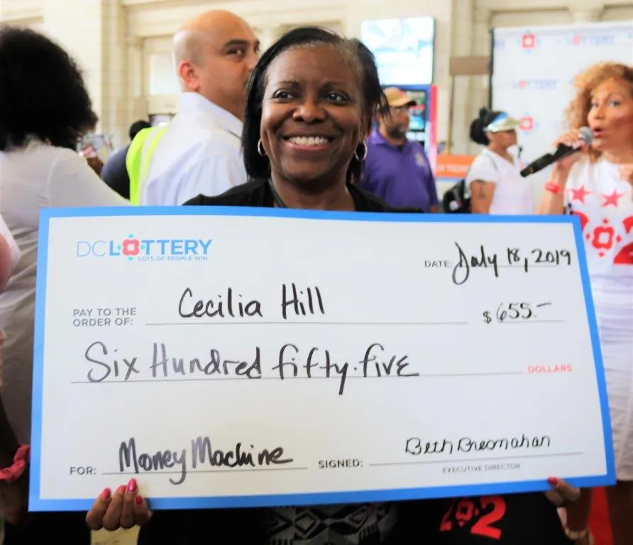 Woman holding large check