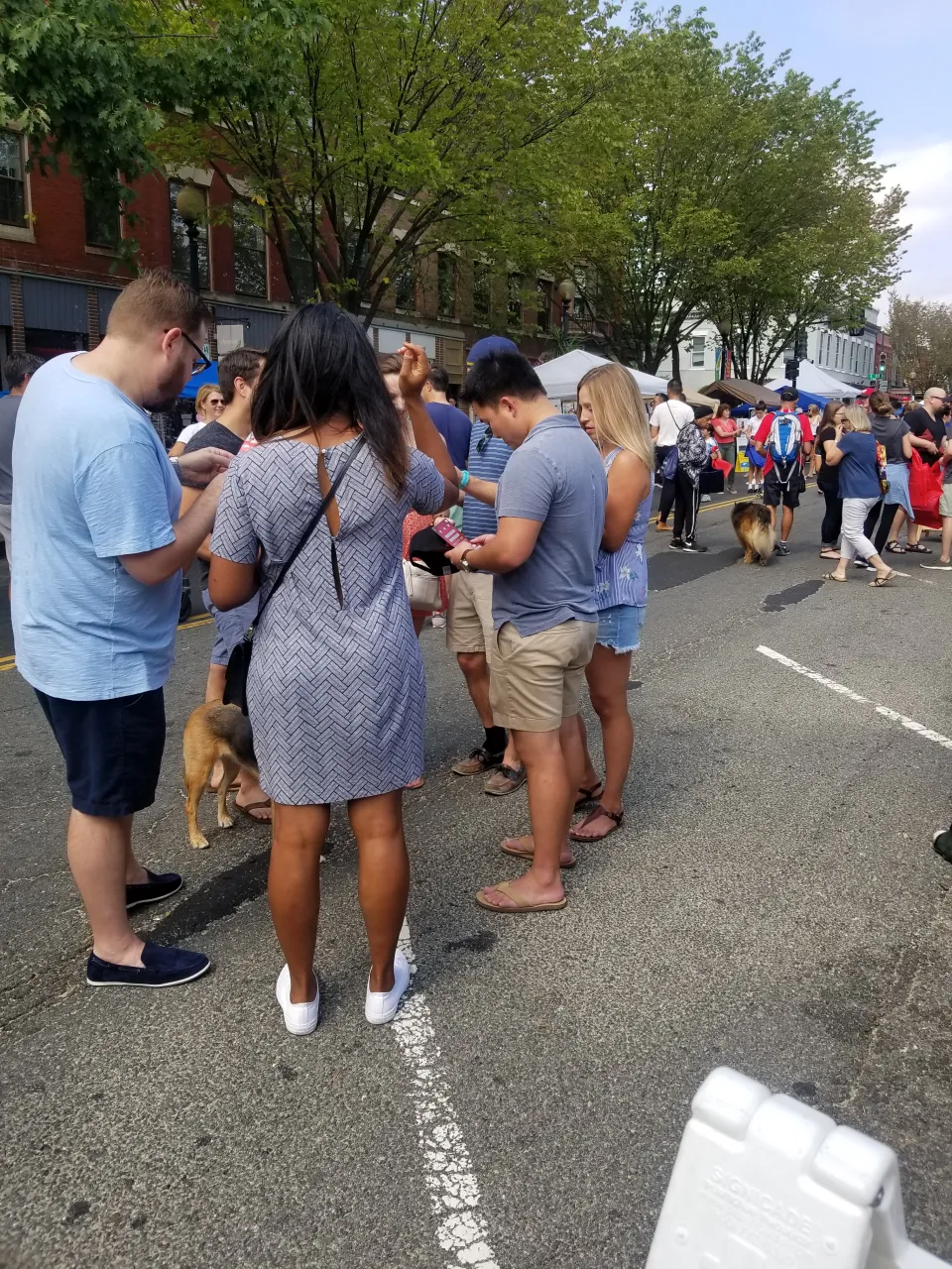 Crowd of player's scratching tickets