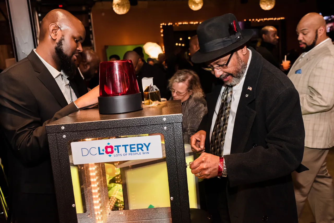 Man trying to open DC Lottery Cash Vault game