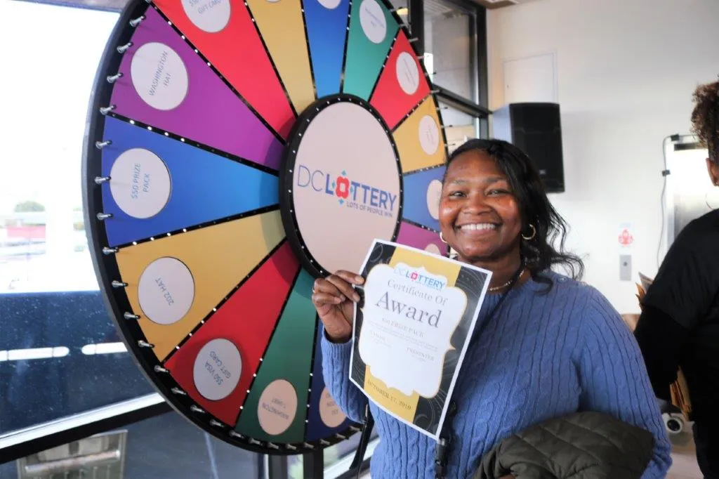 Player at the DC Lottery prize wheel